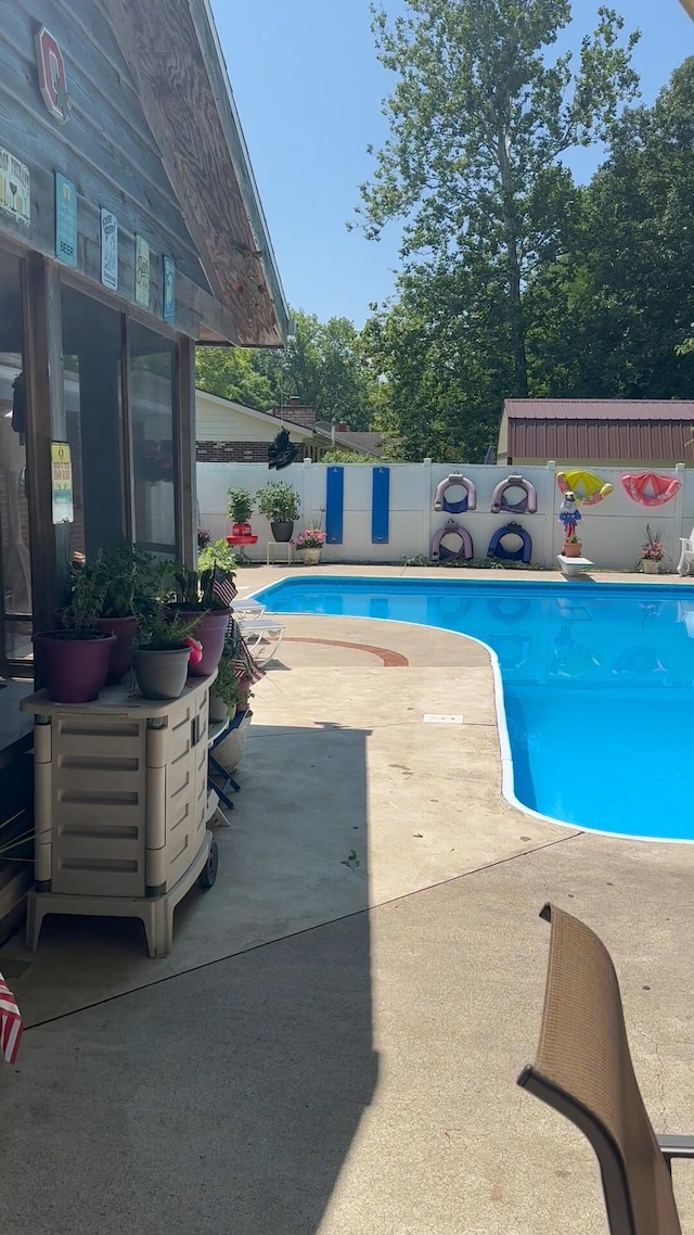 view of pool featuring a fenced in pool, a patio area, and a fenced backyard