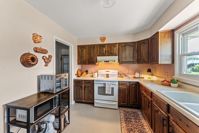 542 Lohnes Dr, Fairborn, OH 45324 - kitchen with electric range, extractor fan, light countertops, backsplash, and dark brown cabinets