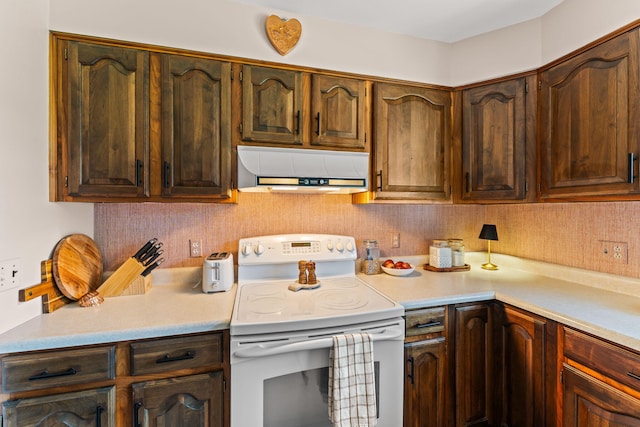 542 Lohnes Dr, Fairborn, OH 45324 - kitchen featuring white electric range oven, extractor fan, light countertops, and decorative backsplash