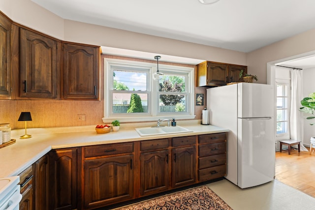 542 Lohnes Dr, Fairborn, OH 45324 - kitchen featuring white appliances, healthy amount of natural light, and light countertops