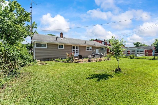 542 Lohnes Dr, Fairborn, OH 45324 - rear view of property featuring a yard and a chimney