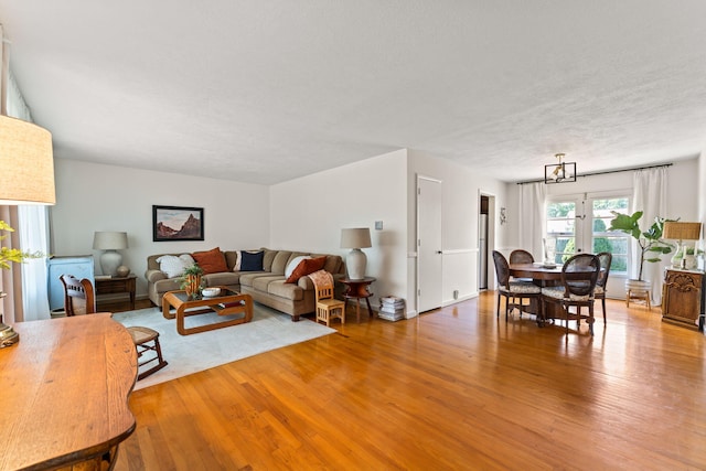 542 Lohnes Dr, Fairborn, OH 45324 - living room featuring wood finished floors and a textured ceiling