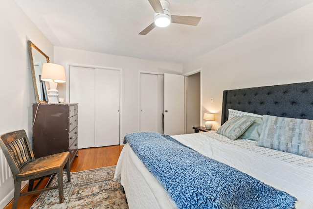 542 Lohnes Dr, Fairborn, OH 45324 - bedroom featuring wood finished floors, two closets, and a ceiling fan