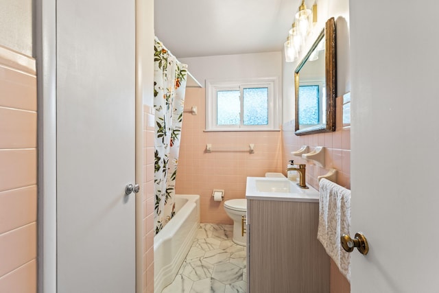 542 Lohnes Dr, Fairborn, OH 45324 - bathroom featuring tile walls, vanity, and shower / bath combination with curtain
