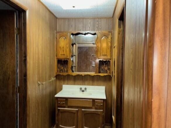 9050 N State Route 49, Greenville, OH 45331 - bathroom featuring vanity and wood walls