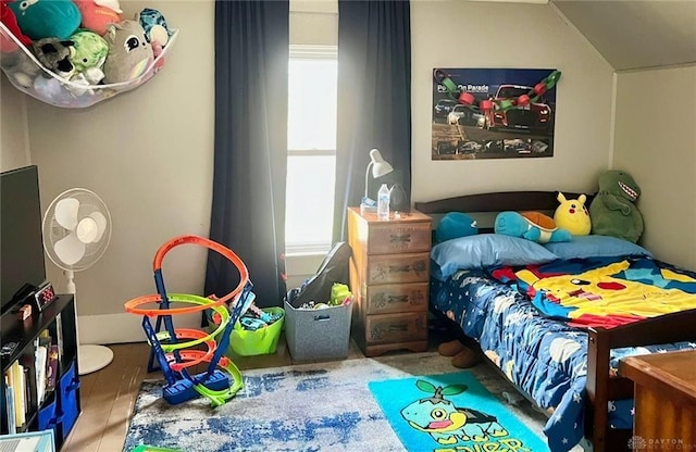 bedroom featuring lofted ceiling