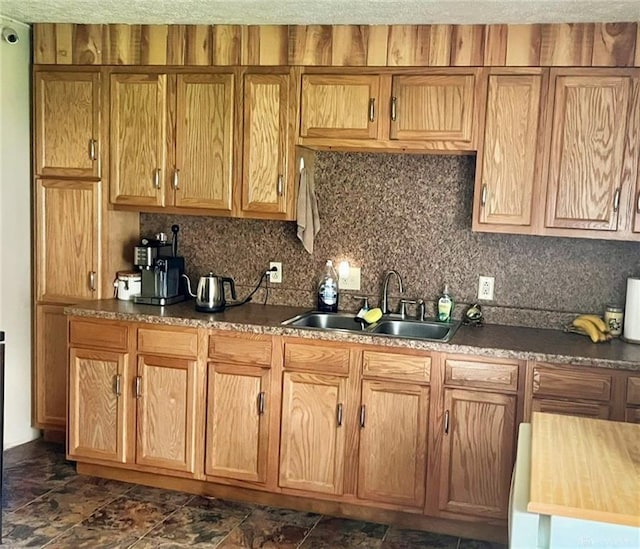 kitchen featuring sink and backsplash