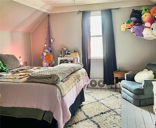 bedroom with vaulted ceiling