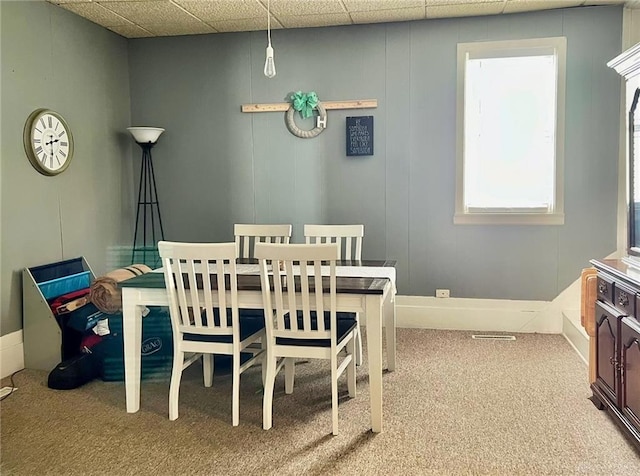 view of carpeted dining area