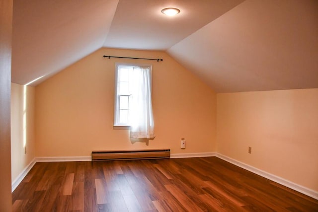 bonus room with baseboards, vaulted ceiling, baseboard heating, and wood finished floors