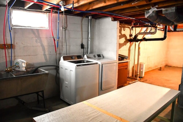 laundry area featuring laundry area, a sink, and washer and dryer