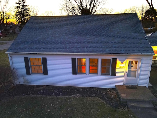 view of front facade with a shingled roof