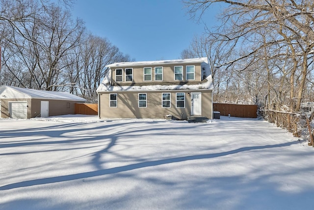 view of front of house featuring an outbuilding and central AC