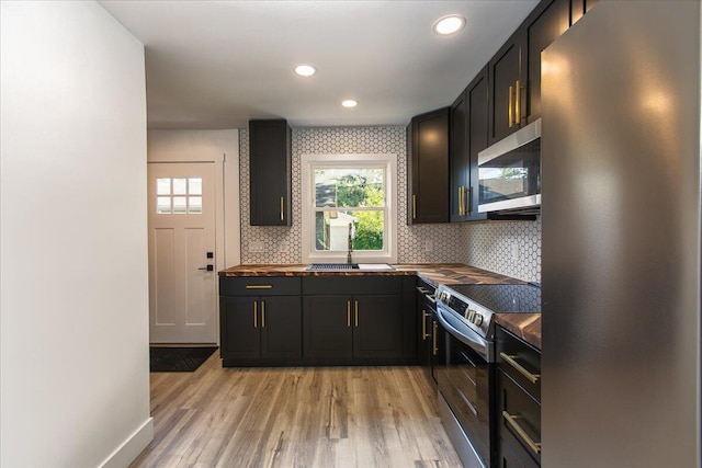 188 S Walnut St, Germantown, OH 45327 - kitchen with stainless steel appliances, wood counters, tasteful backsplash, light wood-style flooring, and recessed lighting