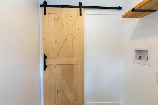 188 S Walnut St, Germantown, OH 45327 - washroom with a barn door and washer hookup