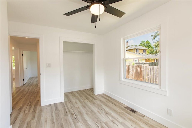 188 S Walnut St, Germantown, OH 45327 - unfurnished bedroom with multiple windows, light wood-style floors, and a closet