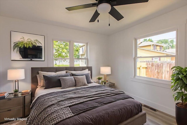 188 S Walnut St, Germantown, OH 45327 - bedroom featuring multiple windows, wood finished floors, and ceiling fan