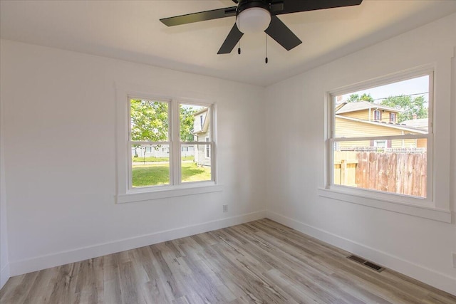 188 S Walnut St, Germantown, OH 45327 - spare room with healthy amount of natural light, light wood finished floors, and a ceiling fan