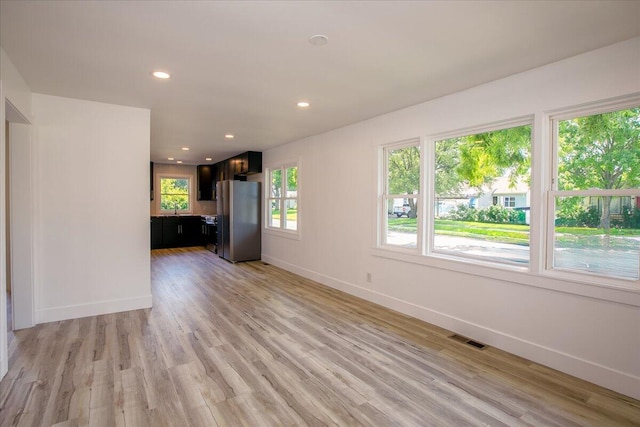 188 S Walnut St, Germantown, OH 45327 - unfurnished living room featuring light wood-style floors and recessed lighting