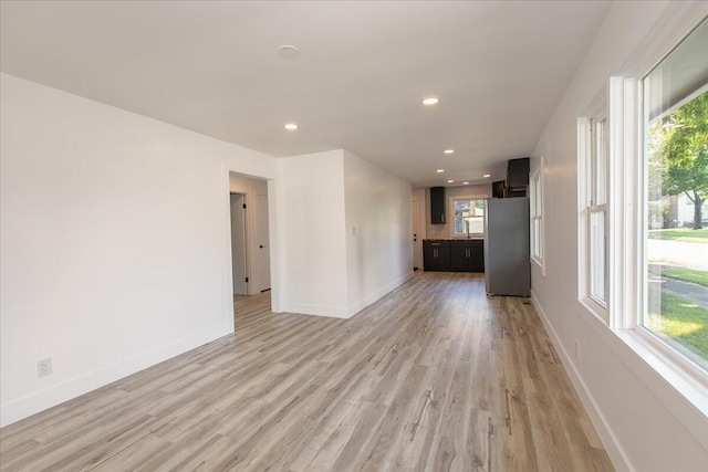 188 S Walnut St, Germantown, OH 45327 - unfurnished living room with light wood-style flooring, plenty of natural light, and recessed lighting