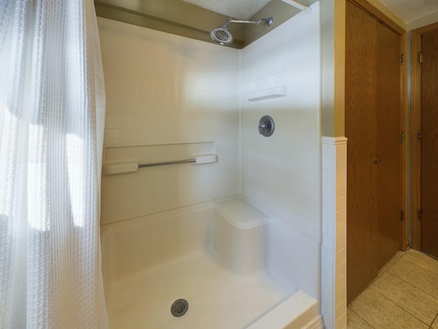 bathroom featuring tile patterned flooring and walk in shower