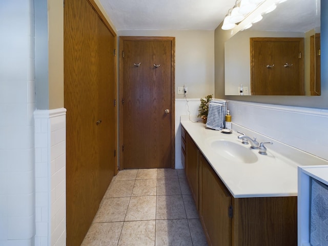 bathroom with tile patterned floors and vanity