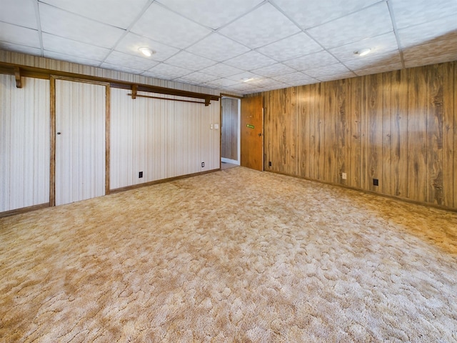 basement featuring light colored carpet