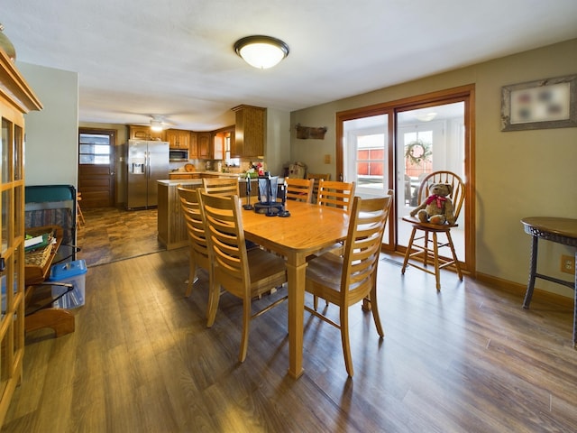 dining area with dark wood-type flooring