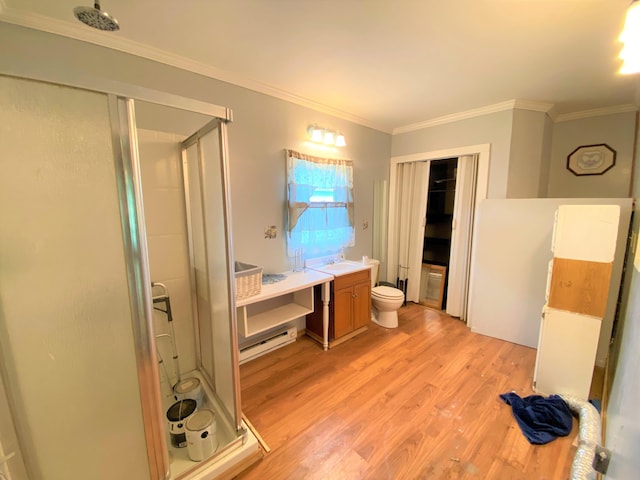 116 N Mill St, De Graff, OH 43318 - bathroom featuring toilet, a shower stall, wood finished floors, vanity, and ornamental molding