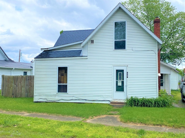 116 N Mill St, De Graff, OH 43318 - rear view of house with roof with shingles, a chimney, and entry steps