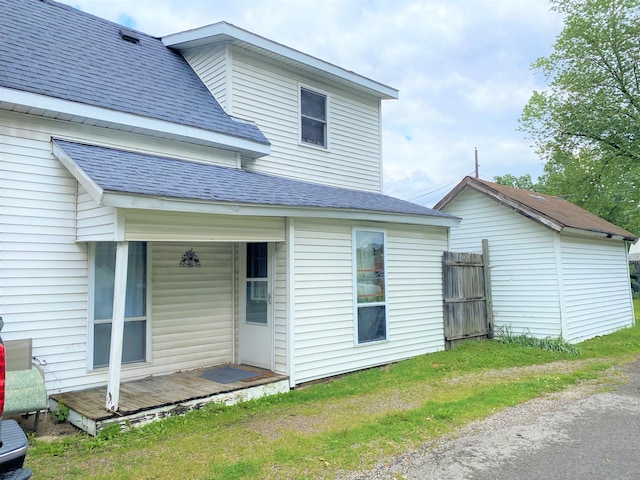 116 N Mill St, De Graff, OH 43318 - rear view of house with a shingled roof