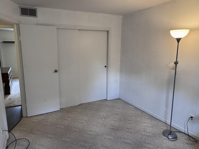 1008 Manor Ln Unit C, Columbus, OH 43221 - unfurnished bedroom featuring carpet and a closet