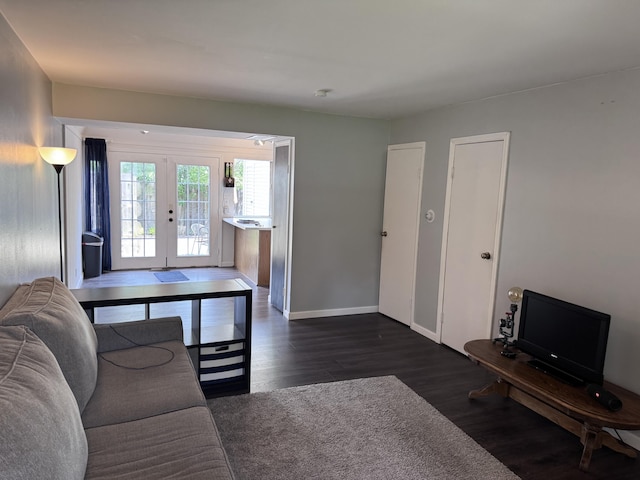 1008 Manor Ln Unit C, Columbus, OH 43221 - living area featuring french doors, dark wood finished floors, and baseboards
