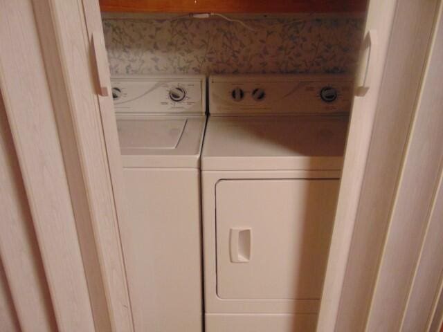 washroom with separate washer and dryer