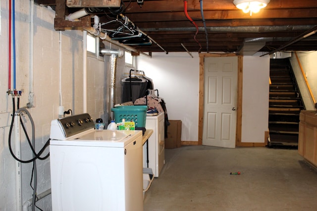 unfinished basement with stairs and independent washer and dryer