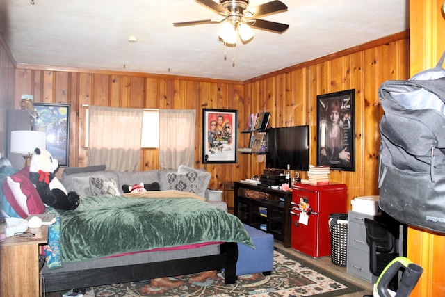 bedroom featuring crown molding and wooden walls