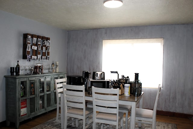 dining area with wood finished floors