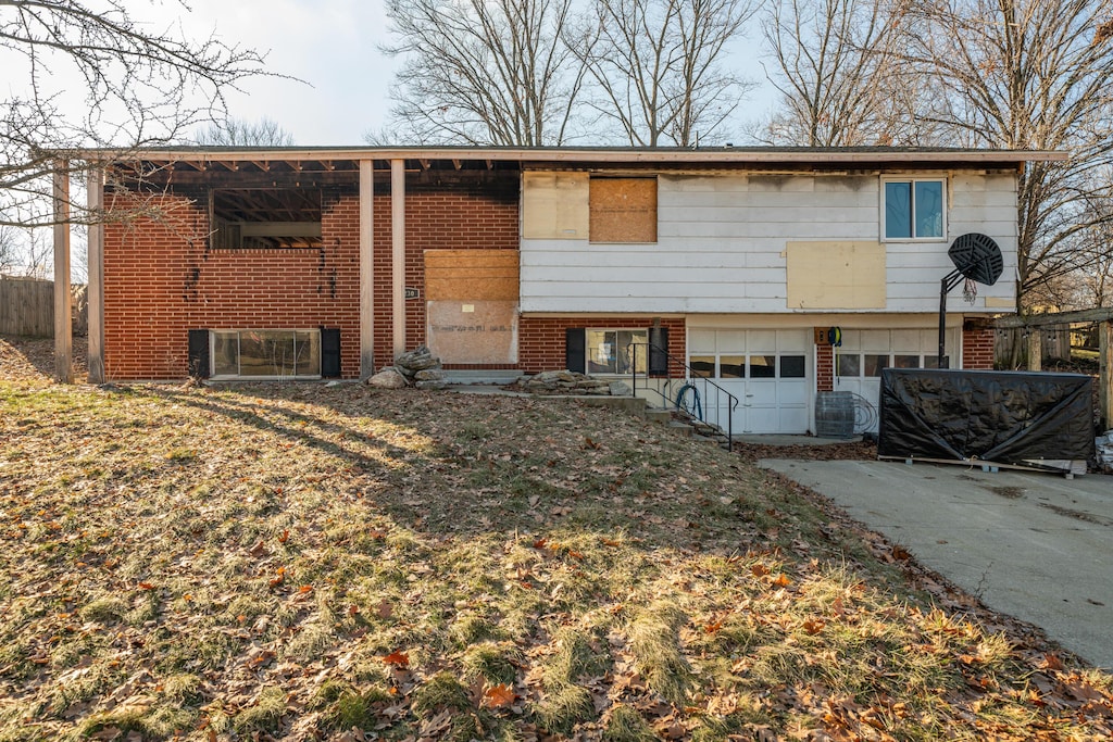 bi-level home featuring a garage