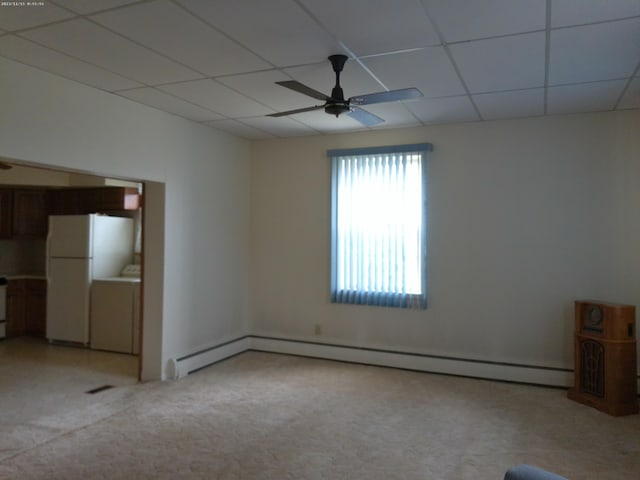 102 S Franklin St, New Bremen, OH 45869 - spare room with light colored carpet, ceiling fan, a baseboard radiator, and a paneled ceiling