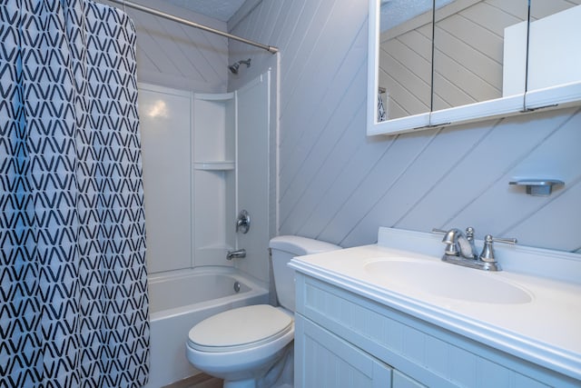 full bathroom featuring shower / tub combo with curtain, vanity, and toilet