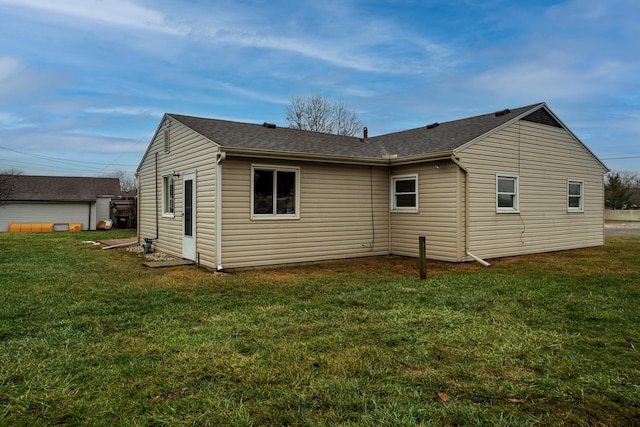 view of side of home featuring a lawn