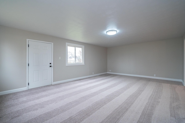 empty room with light colored carpet