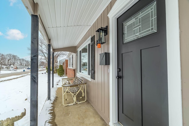 view of snow covered property entrance