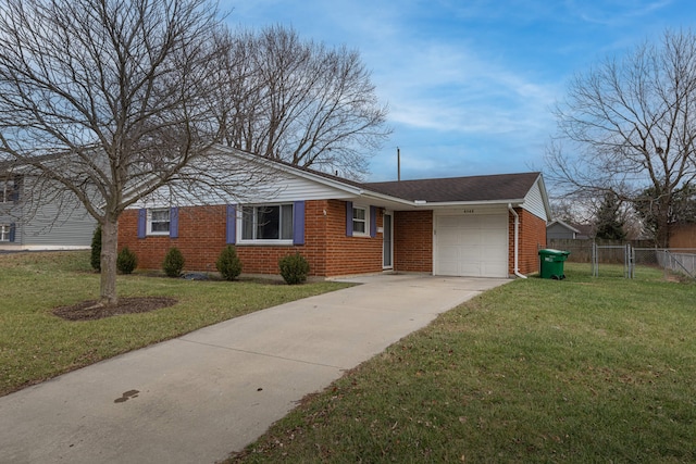 ranch-style home with a garage and a front yard