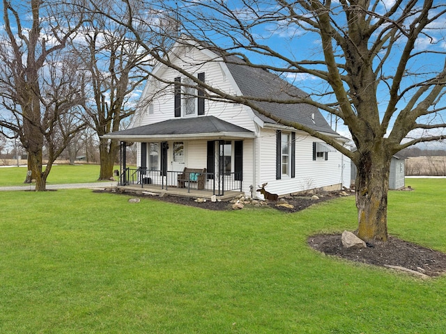 view of front of home with a front yard and a porch