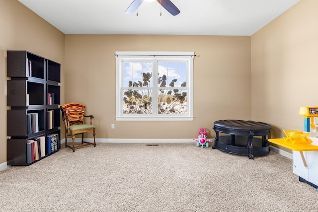 game room featuring ceiling fan, carpet floors, and baseboards