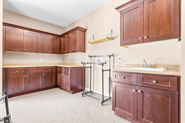 kitchen with light countertops and a sink