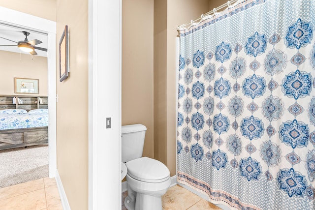 ensuite bathroom with toilet, ensuite bath, tile patterned flooring, and a ceiling fan