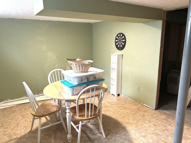 dining room with a textured ceiling
