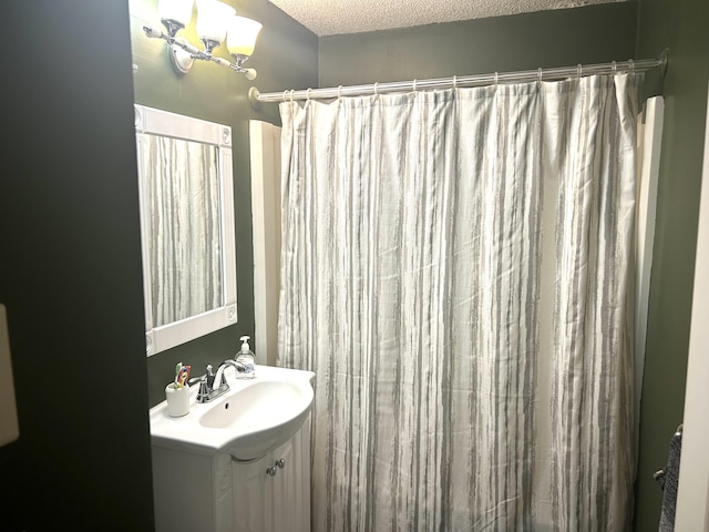 bathroom with vanity and a textured ceiling